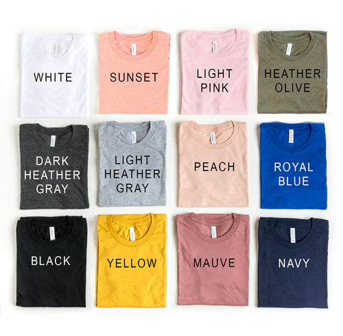 Be Kind T-shirt collection featuring various colors and bold lettering on soft cotton fabric.