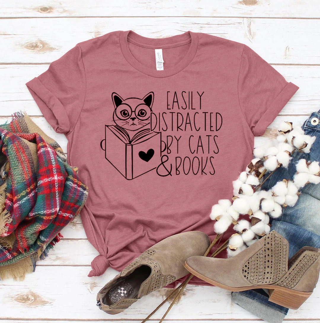 Mauve t-shirt with cat and book graphic and text &