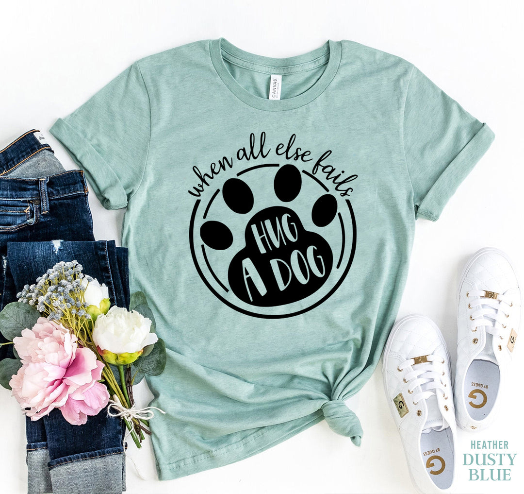 Dusty Blue t-shirt with paw print design and 'When All else Fails Hug A Dog' text - WordinWear