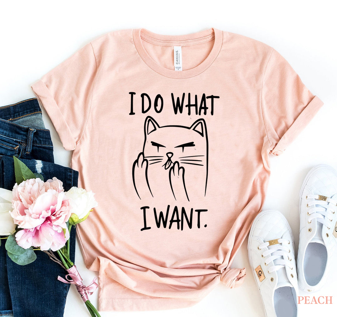 Peach t-shirt with a cat graphic and 'I DO WHAT I WANT' text - WordinWear