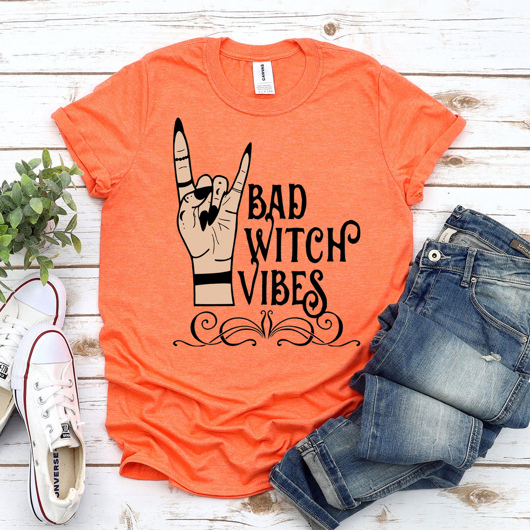 Orange t-shirt with 'Bad Witch Vibes' design - WordinWear