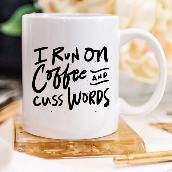 I Run On Coffee and Cuss Words ceramic coffee mug, perfect for coffee lovers with humor.