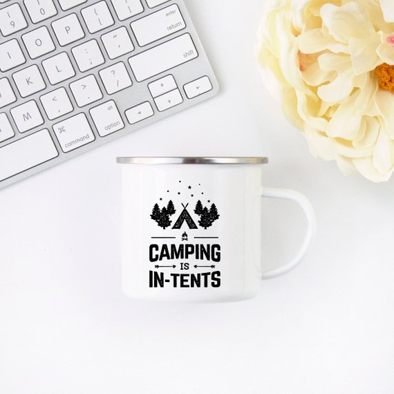 Camping mug with graphic text 'Camping is in-tents' and outdoor design, perfect for outdoor adventures.